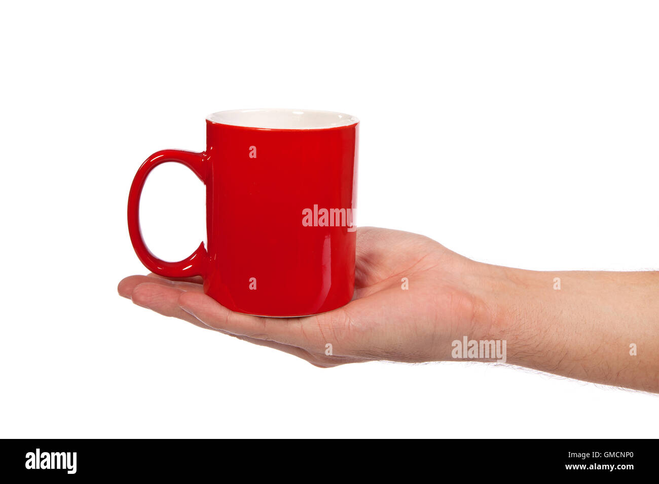 Male hand is holding a red cup Stock Photo