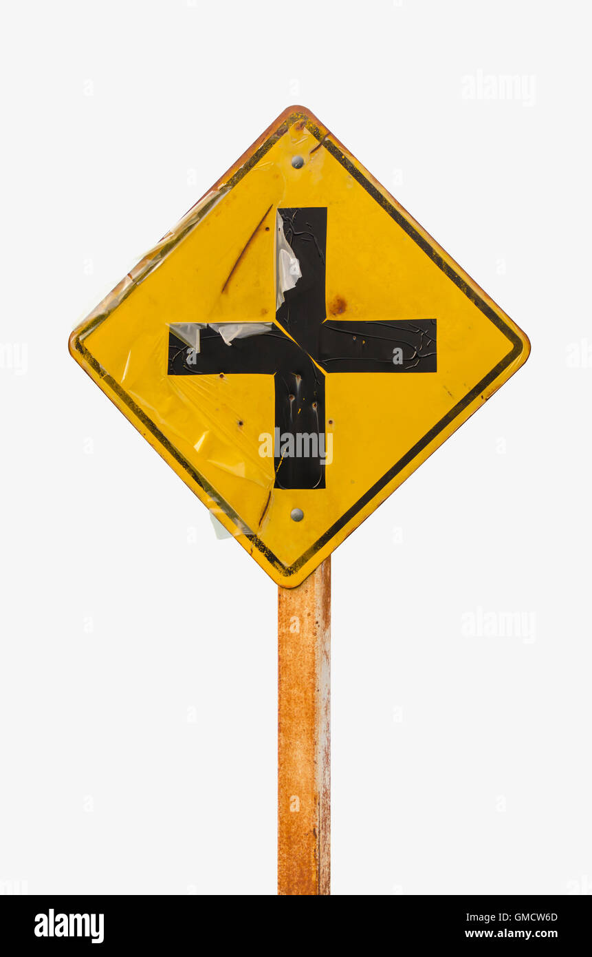 Intersection ahead old road sign on white background Stock Photo