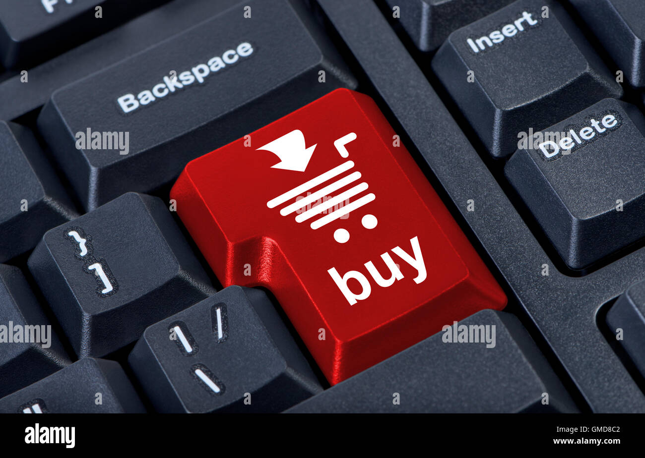 Computer red button buy with cart, internet trade concept. Stock Photo