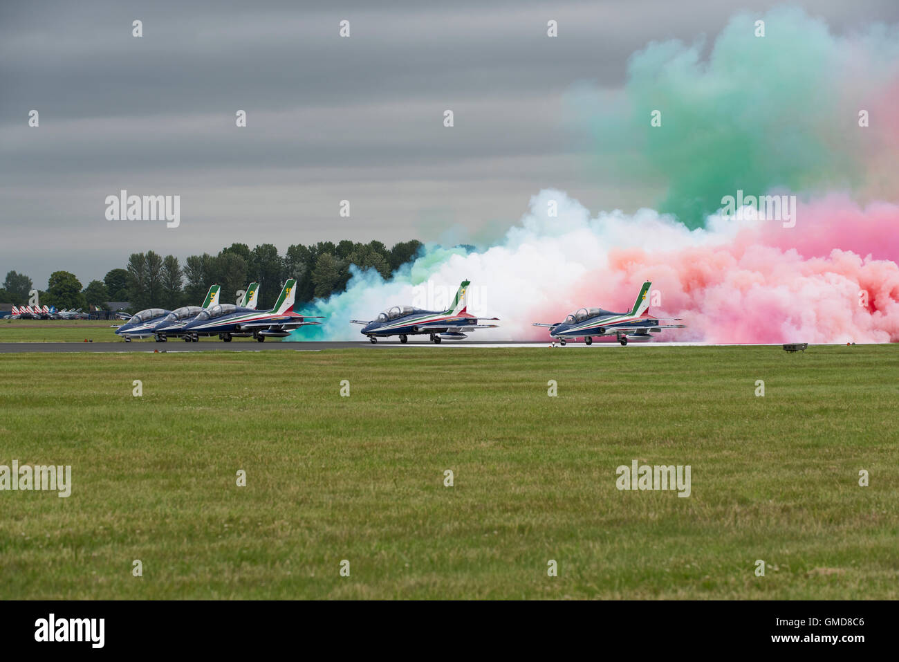 The Italian Air Force Military Aerobatic Display Team The Frecce Tricolori make a lot of smoke as they begin to display at RIAT Stock Photo