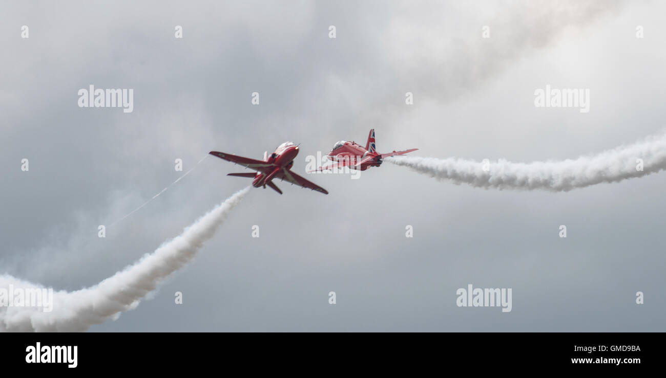The British RAF Red Arrows Aerobatic display team show just how close they fly to each other in their head to head crossovers Stock Photo