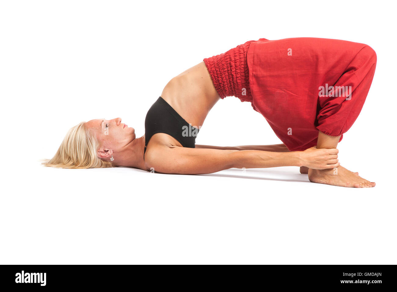 Practicing Yoga. Young woman isolated on white background Stock Photo ...