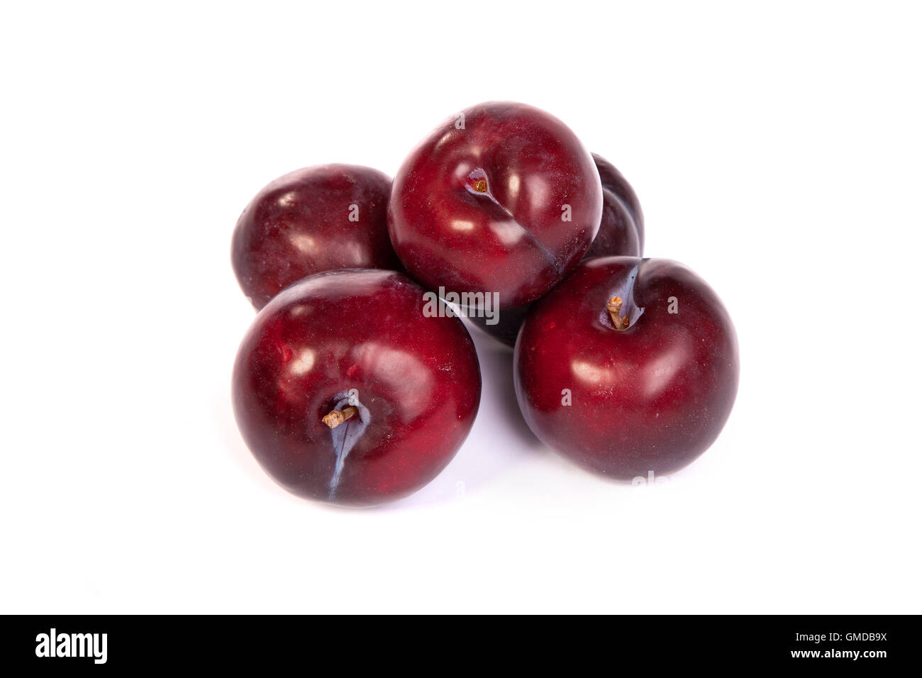 Group of plums  on white Stock Photo