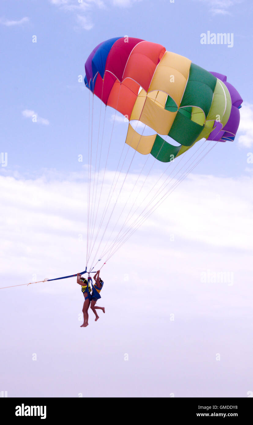 Parachute in tow with two people Stock Photo Alamy