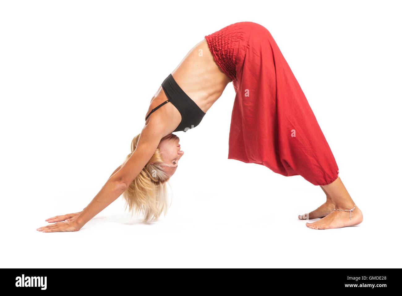 Practicing Yoga. Young woman isolated on white background Stock Photo ...