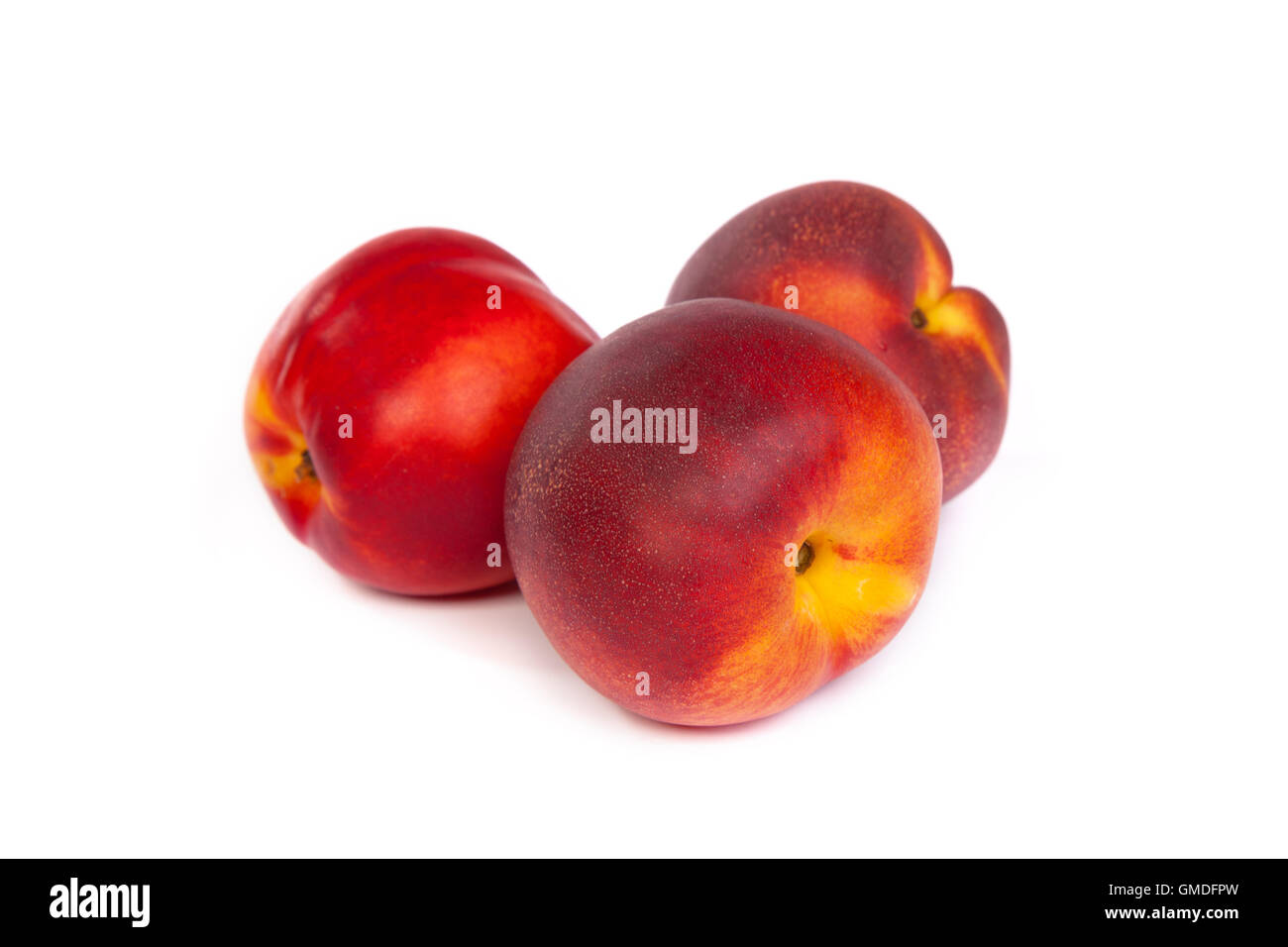 Three fresh nectarines on white Stock Photo Alamy