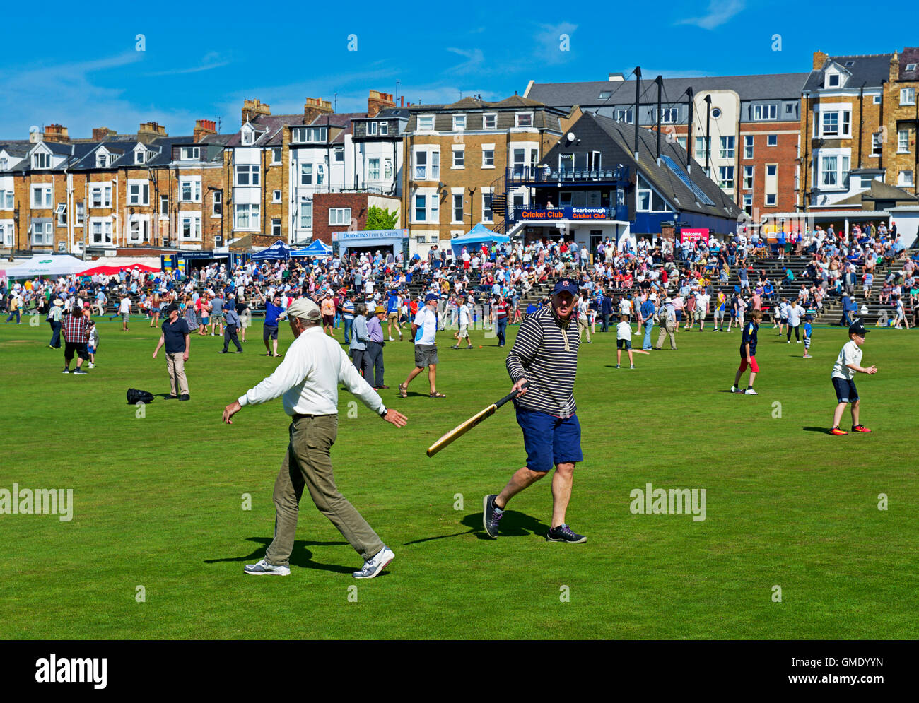 The crowd play games on the pitch during an interval, Scarborough Cricket Club, North Yorkshire, England UK Stock Photo