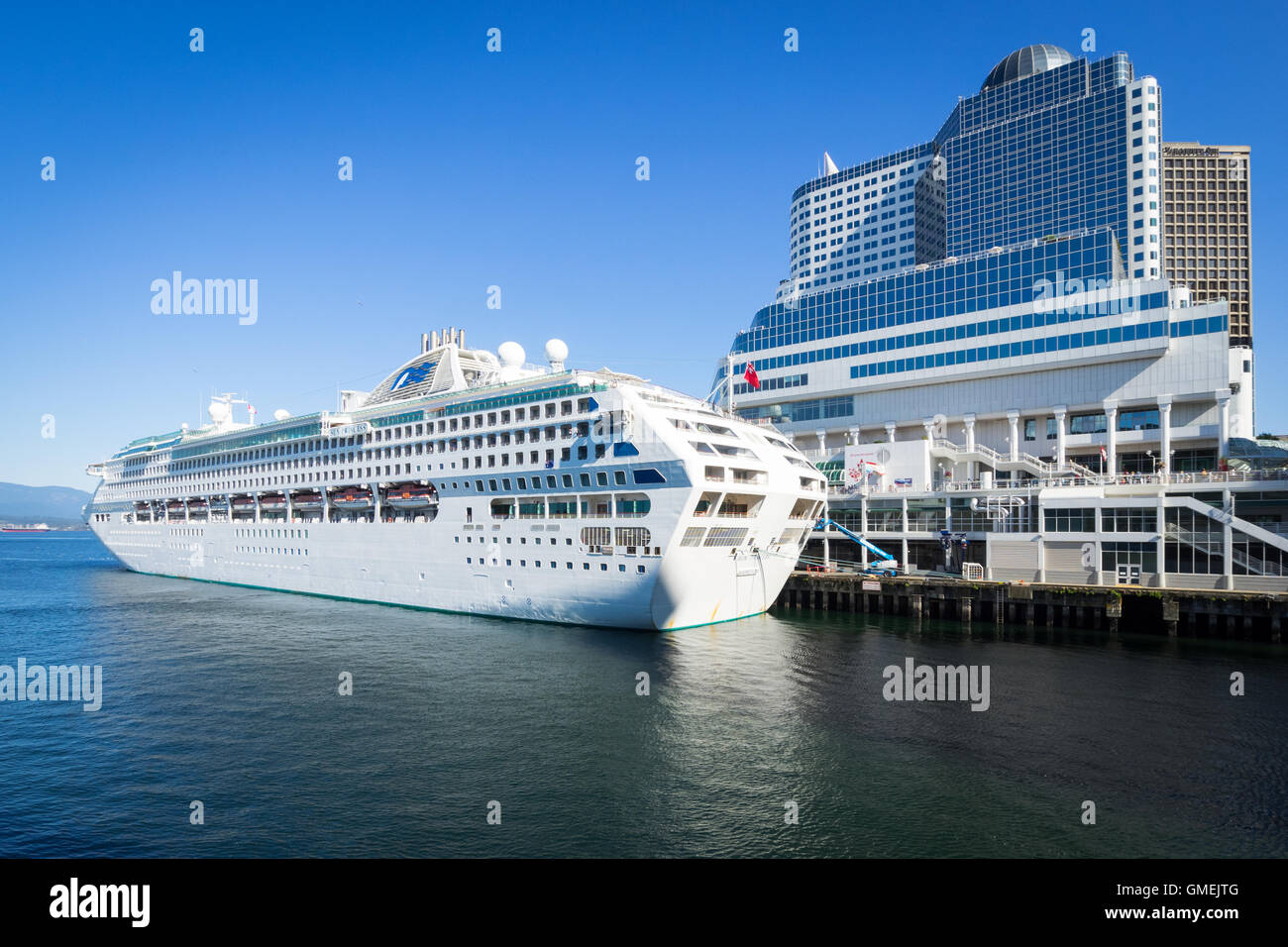 The Sun Princess cruise ship docked at Canada Place.  Pan Pacific Hotel in background. Vancouver, Canada. Stock Photo