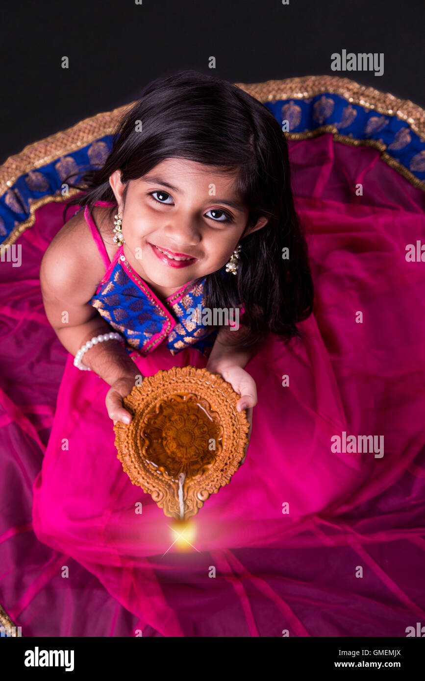 Girl Making Rangoli And Decorating With Oil Lamps For Diwali Stock Photo   Download Image Now  iStock