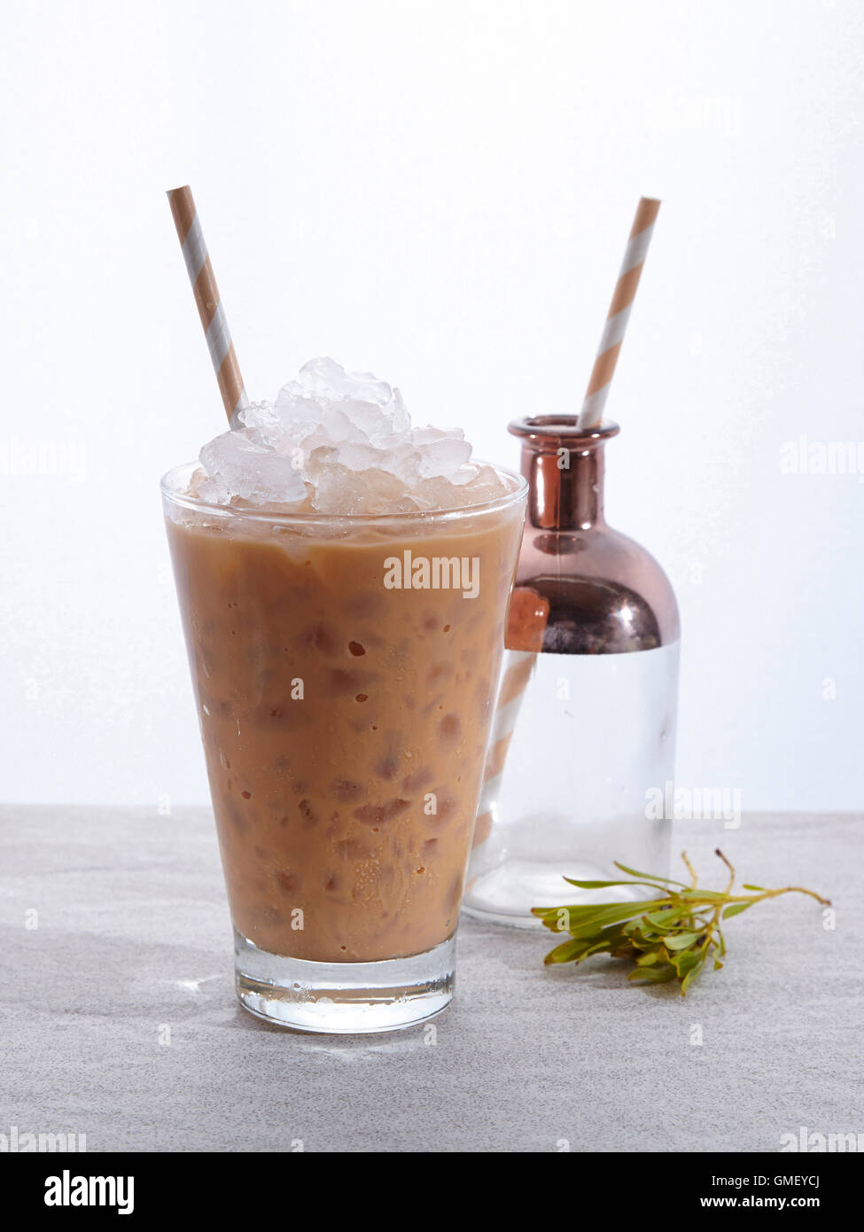 Milk tea refers to any form of beverage found in many cultures, containing some combination of tea and milk. Stock Photo