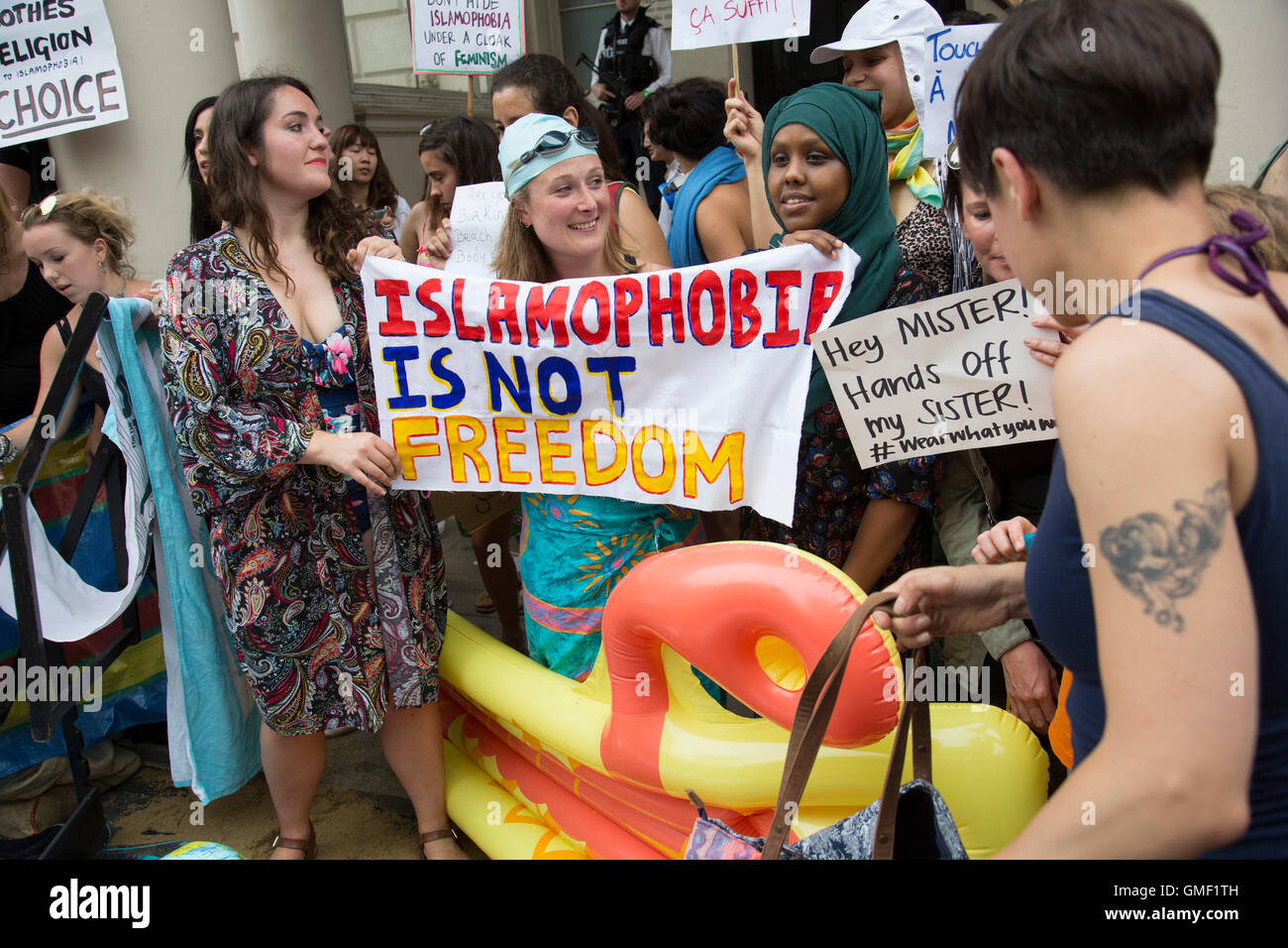 London, UK. 25th August, 2016. Wear what you want protest at the French embassy against the burkini ban for Muslim women on France’s beaches on 25th August 2016 in London, United Kingdom. Activists called on fellow supporters to descend on Knightsbridge saying “Come along to the French embassy and wear what you want - burkinis, bikinis, anything goes. Bring beach gear: beach umbrellas, towels, bat and ball, boules... Credit:  Michael Kemp/Alamy Live News Stock Photo