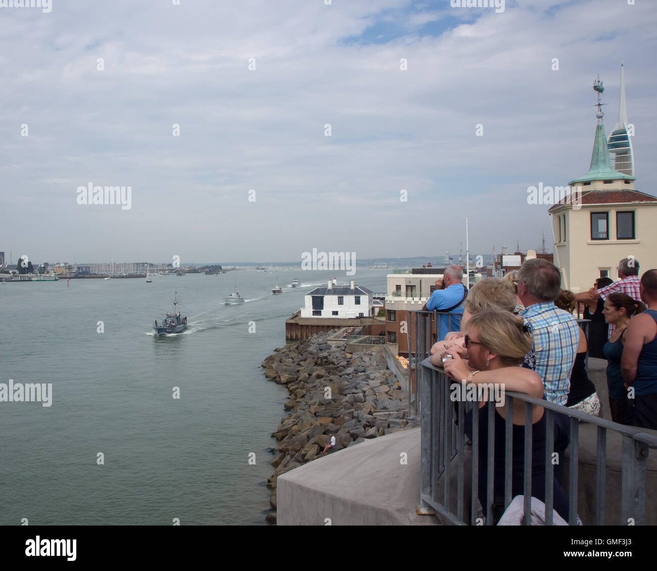 Portsmouth, UK, August 25th 2016. Crowds gather on Portsmouth round tower to watch Harbour defence motor launch 1387 leads the way as five Coastal defence boats conduct a sail past of Portsmouth dockyard to mark the centenary of the Royal Navy coastal force . Credit:  simon evans/Alamy Live News Stock Photo