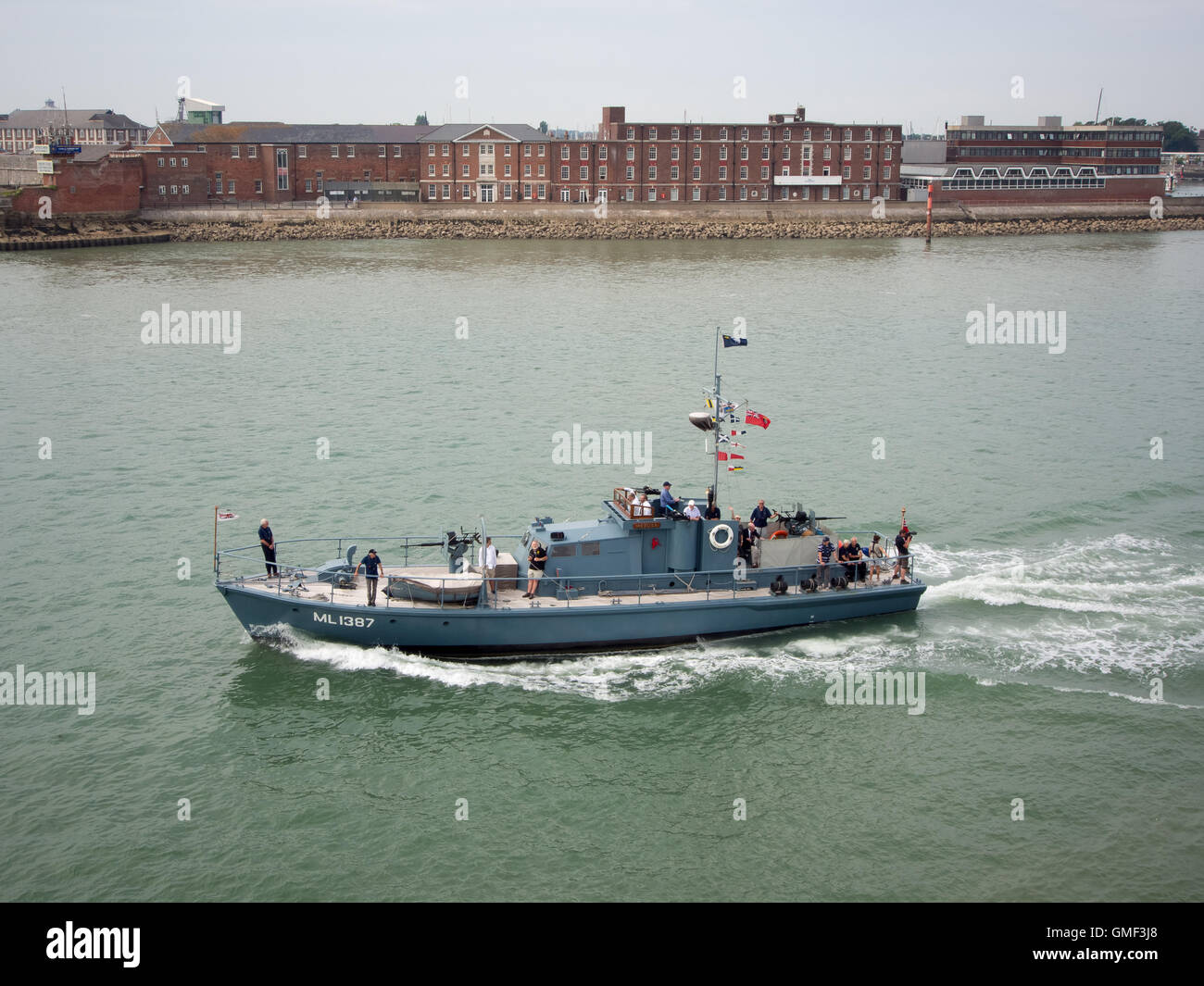 Portsmouth, UK, August 25th 2016.  Motor launch 1387 sails out of Portsmouth harbour, past Fort Blockhouse military base as she leads five Coastal defence boats in a sail past of Portsmouth dockyard to mark the centenary of the Royal Navy coastal force . Credit:  simon evans/Alamy Live News Stock Photo