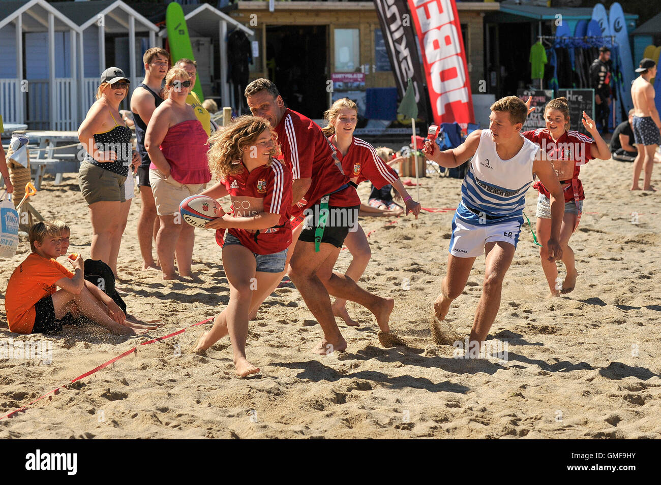 Newquay, UK. 26th Aug, 2016. Lusty Glaze, Newquay, Cornwall. 26th August, 2016. Blessed with beautiful sunny weather, The ‘Niftys' battle it out with ‘Newbury Colts' to become the Beach Tag Rugby Champions at the Lusty Glaze annual Bank Holiday event. Photographer Credit:  Gordon Scammell/Alamy Live News Stock Photo
