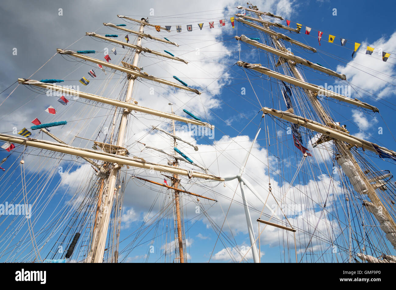 Blyth, UK. 26th Aug, 2016. Tall ships moored in the the Port of Blyth in Northumberland. Masts of the Polish tarining ship Dar Młodzieży in the foreground with an example of modern wind power behind  Credit:  Washington Imaging/Alamy Live News Stock Photo