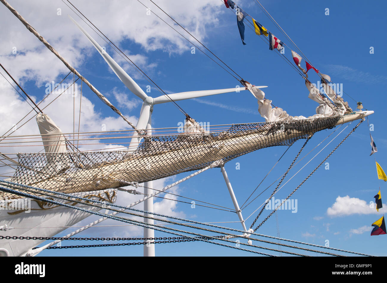 Blyth, UK. 26th Aug, 2016. Crowds visit the Port of Blyth in Northumberland to see the Tall Ships moored. The bowsprit of the Polish training ship Dar Młodzieży with a modern example of wind power behind  Credit:  Washington Imaging/Alamy Live News Stock Photo