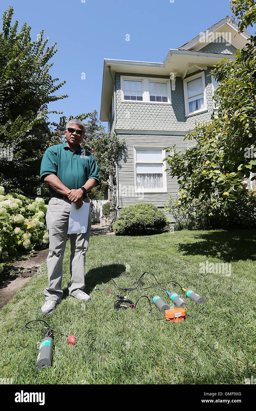 Napa, CA, USA. 17th Aug, 2016. Rufus Catchings, a research geophysicist with the United States Geological Service, stands near sensors and recorders that will be used to monitor a number of tiny explosions to map soils underground as part of an earthquake study. The home in the background, located in Old Town, is one site where the sensors will be buried. © Napa Valley Register/ZUMA Wire/Alamy Live News Stock Photo
