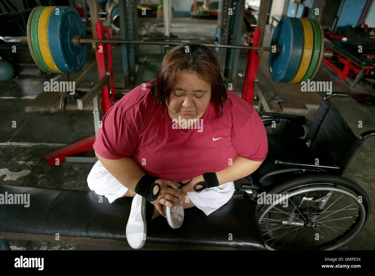 Quezon City, Philippines. 27th Aug, 2016. Philippine powerlifter Adeline Dumapong-Ancheta rests during a training session in preparation for the Rio Paralympic Games in Quezon City, the Philippines, Aug. 27, 2016. Adeline Dumapong-Ancheta, a polio victim since she was three years old, has won many medals in powerlifting events in various international competitions and is qualified to compete in the Rio Paralympic Games in September. © Rouelle Umali/Xinhua/Alamy Live News Stock Photo