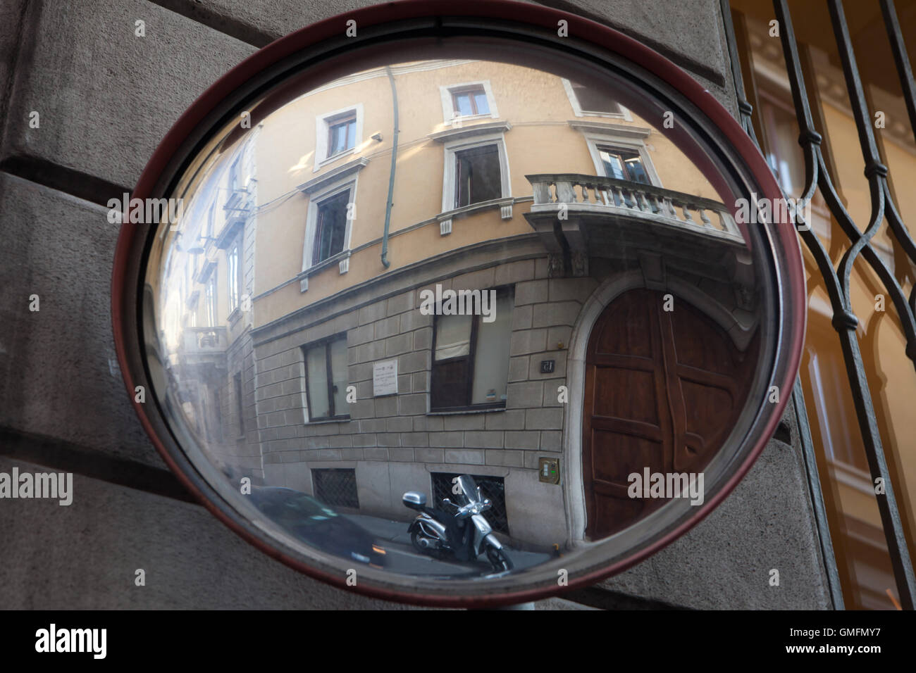 Convex mirror in Milan, Lombardy, Italy. Stock Photo