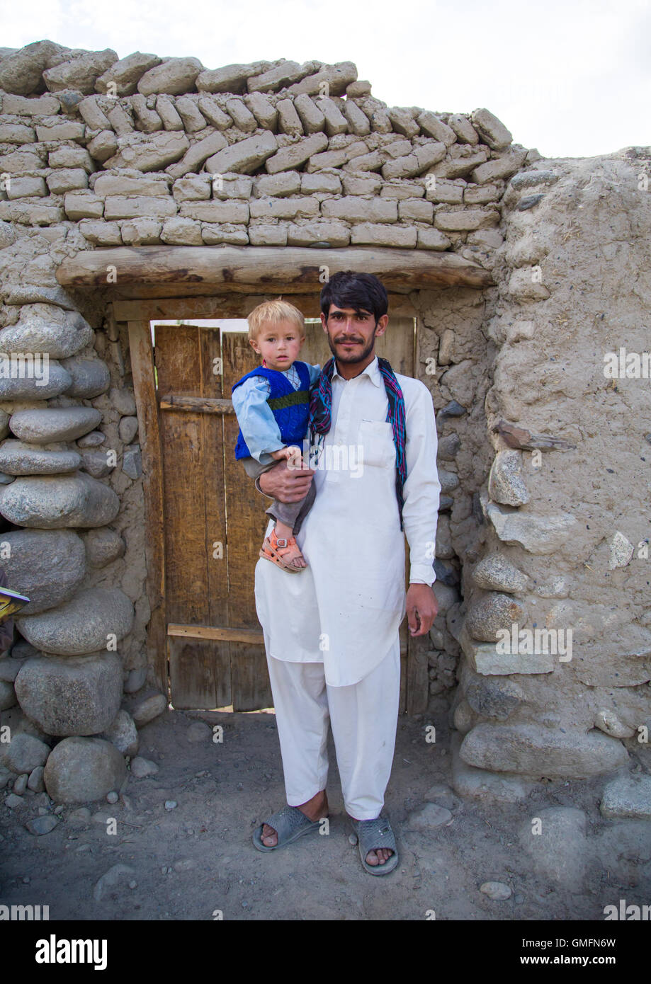 Portrait Of An Afghan Boy With Blonde Hair With His Father Stock