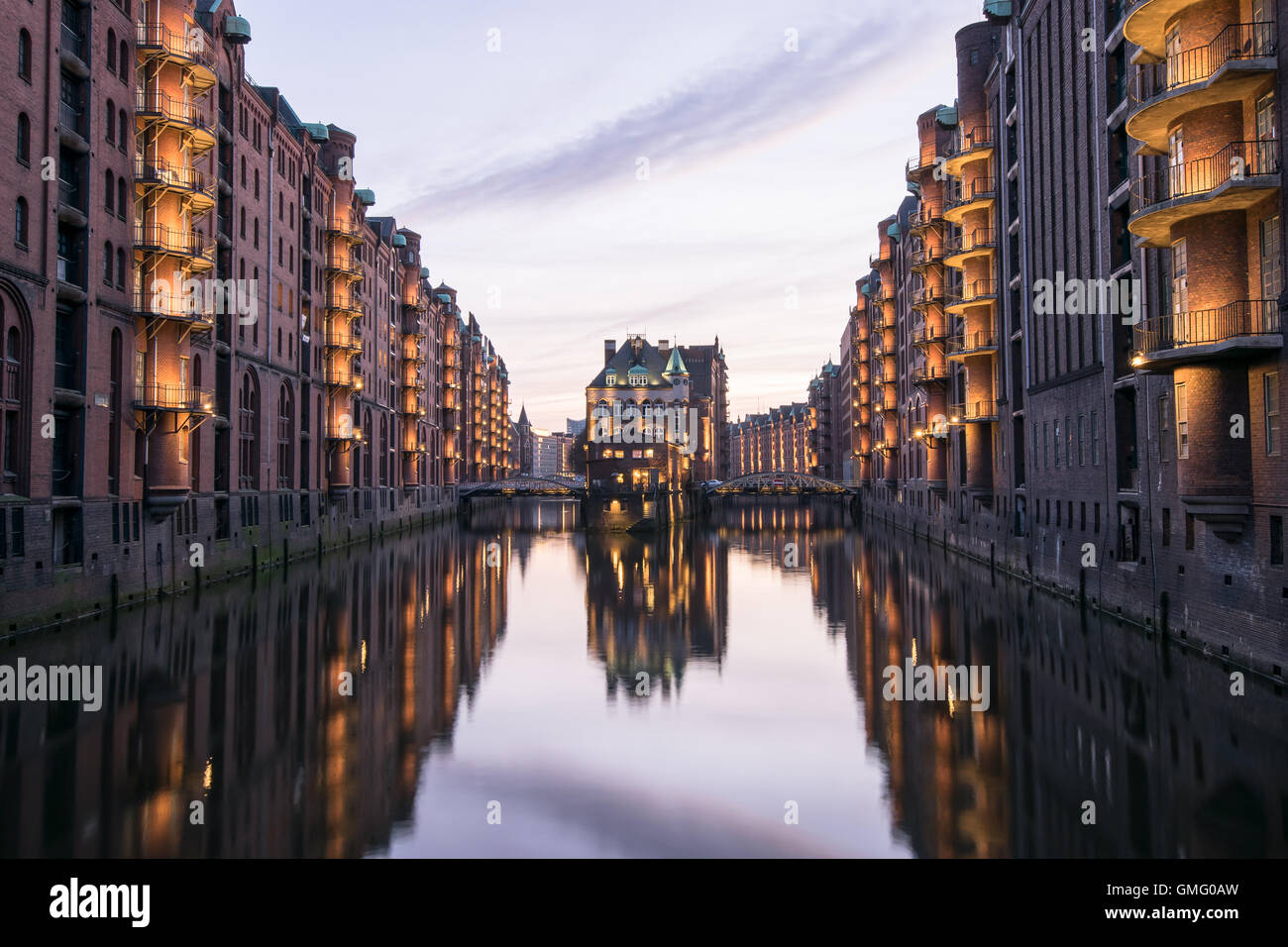 Hamburg - just illuminated speicherstadt with house reflection in the water at daylight Stock Photo