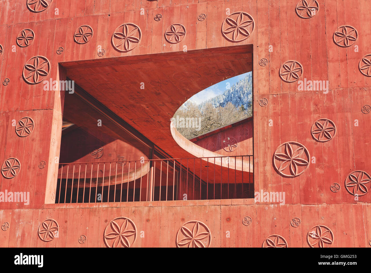 red concrete building in switzerland with flower pattern Atelier Bardill by Valerio Olgiati Stock Photo