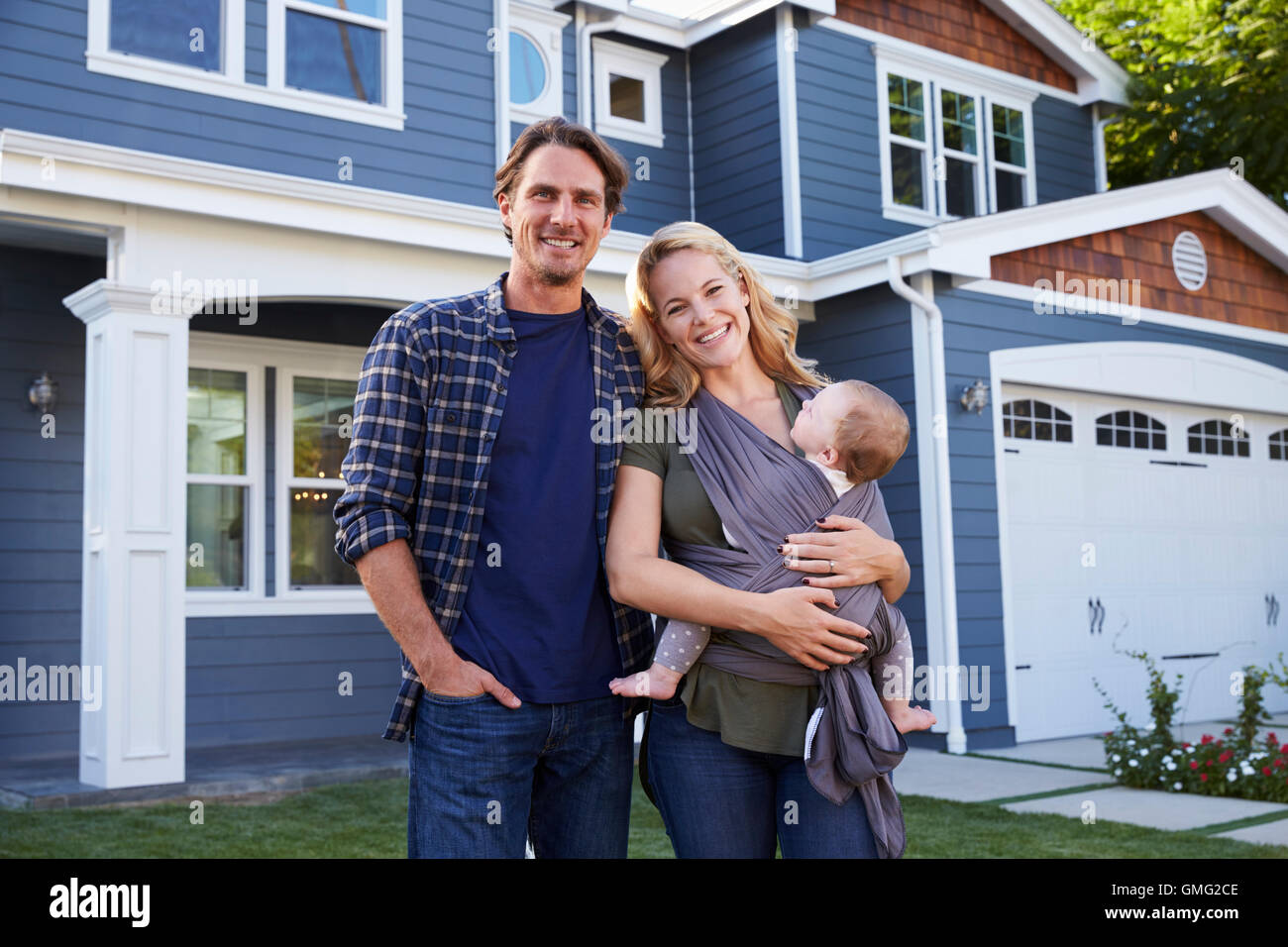 Portrait Of Family Standing Outside House Stock Photo - Alamy