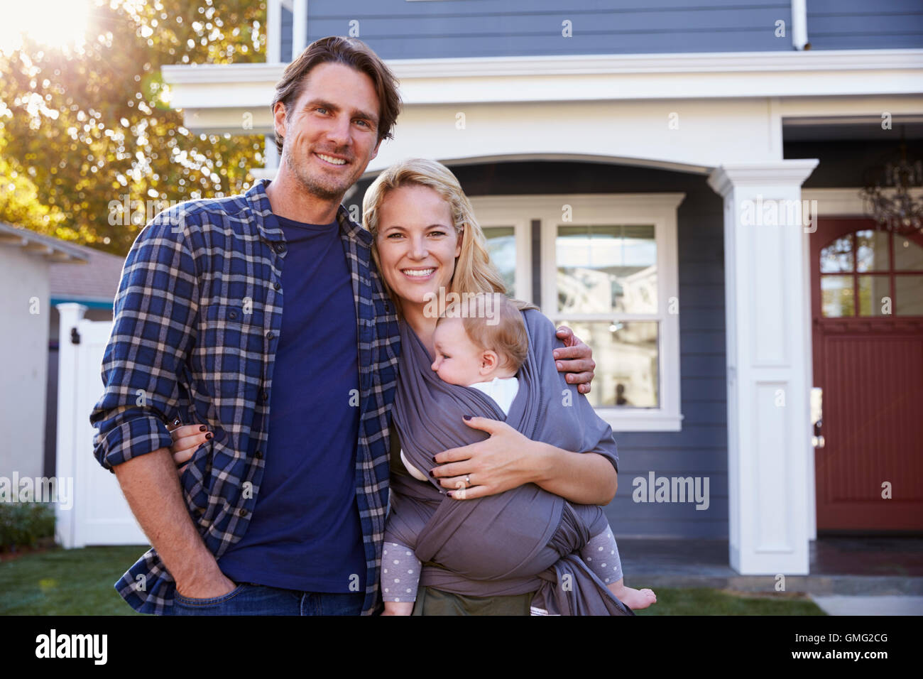 Portrait Of Family Standing Outside House Stock Photo - Alamy