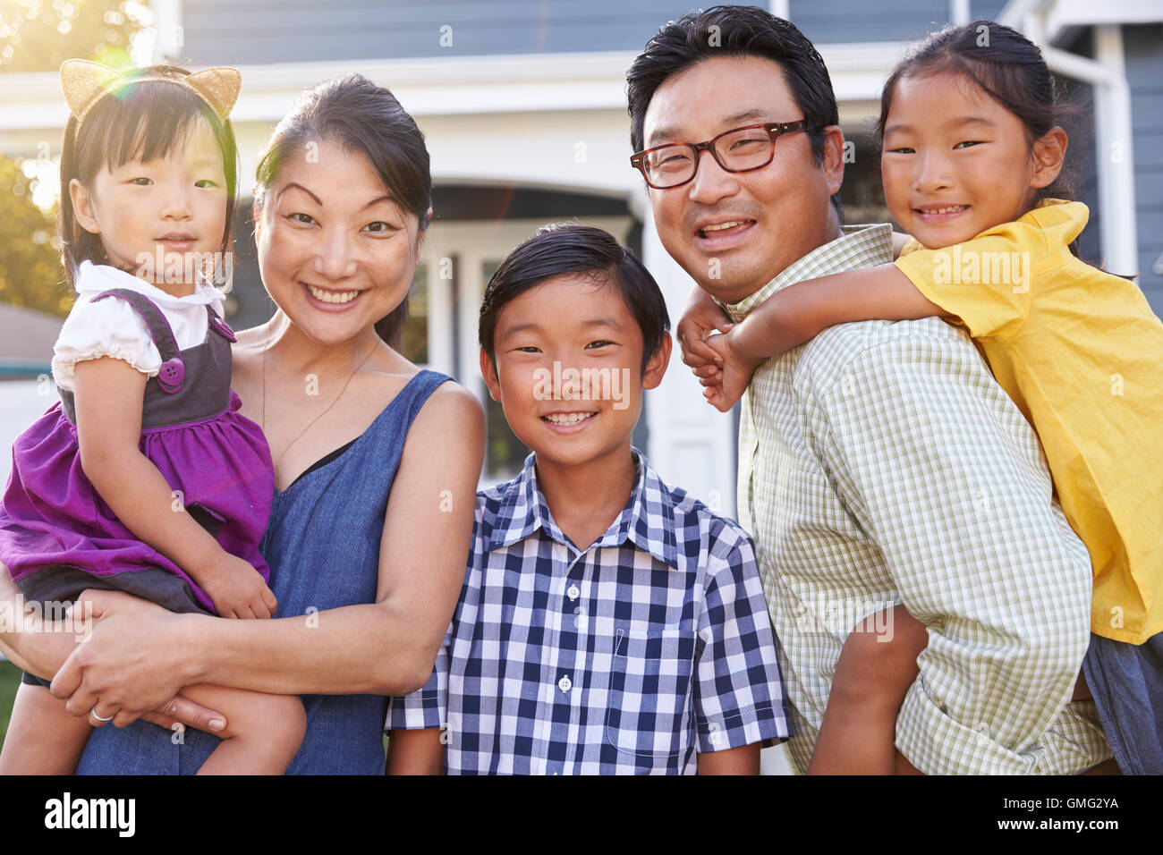 Portrait Of Family Standing Outside House Stock Photo - Alamy