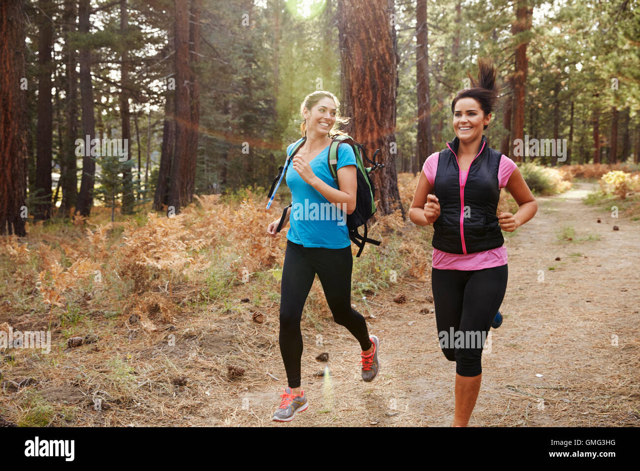 Two young women running in a forest hi-res stock photography and images ...