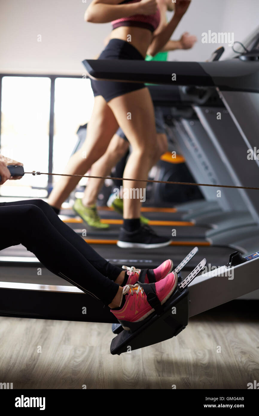 Close Up Of People Using Equipment In Busy Gym Stock Photo Alamy