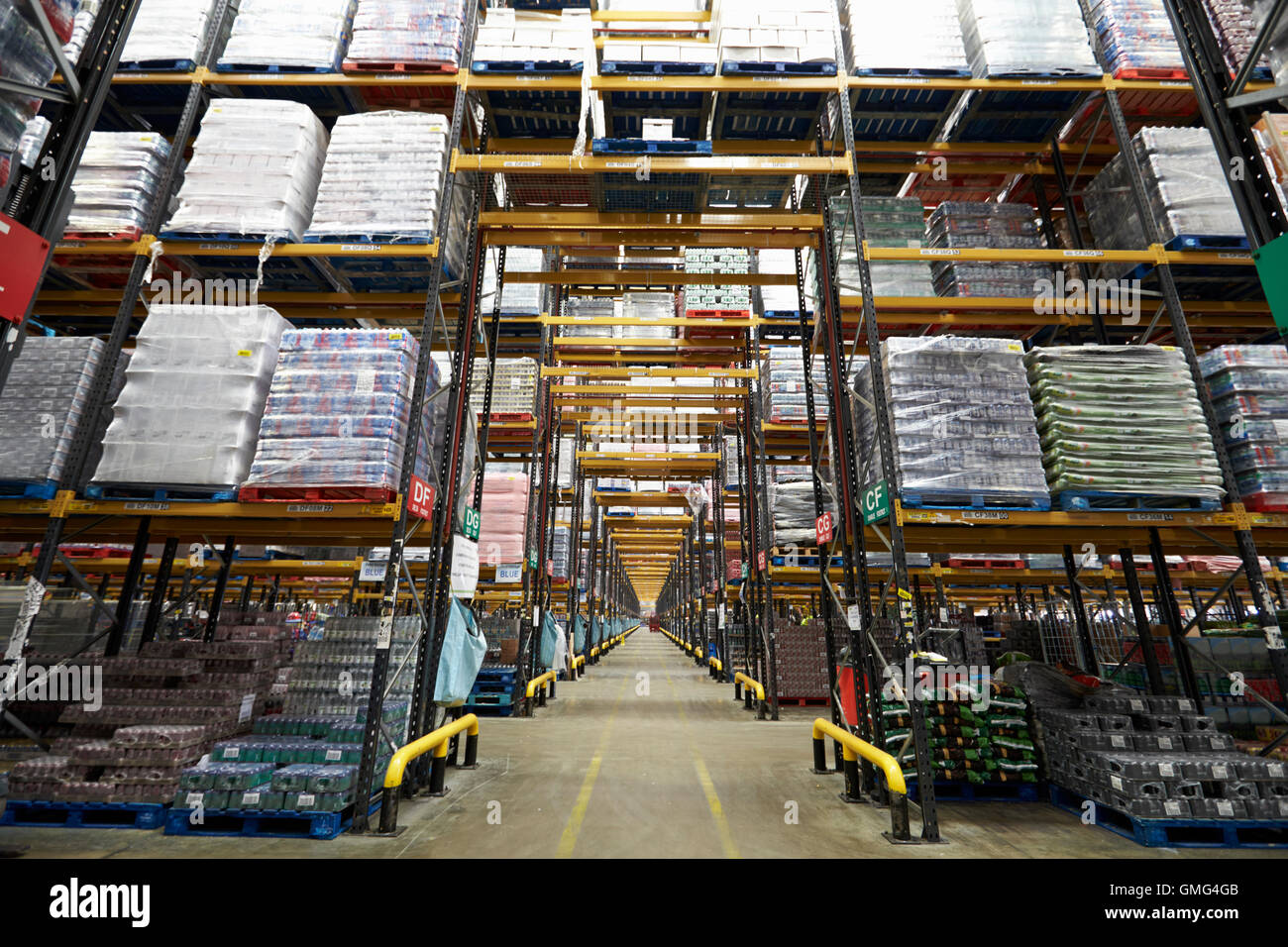 Long aisle between storage racks in a distribution warehouse Stock