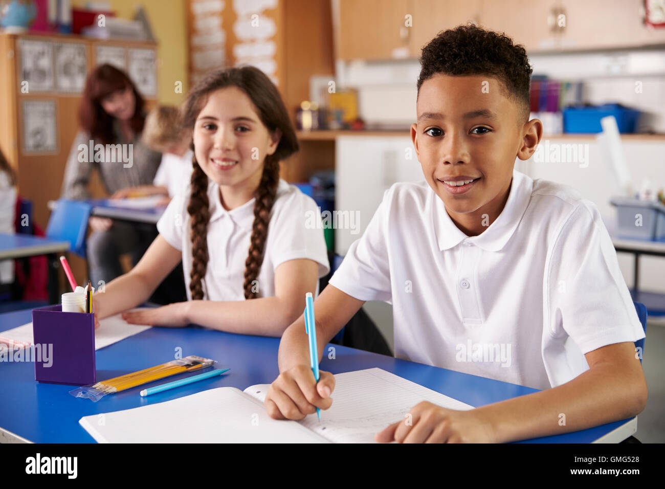 Two primary school pupils in classroom looking to camera Stock Photo ...