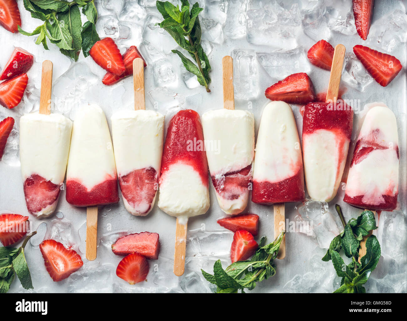 Strawberry yogurt ice cream popsicles with mint Stock Photo Alamy