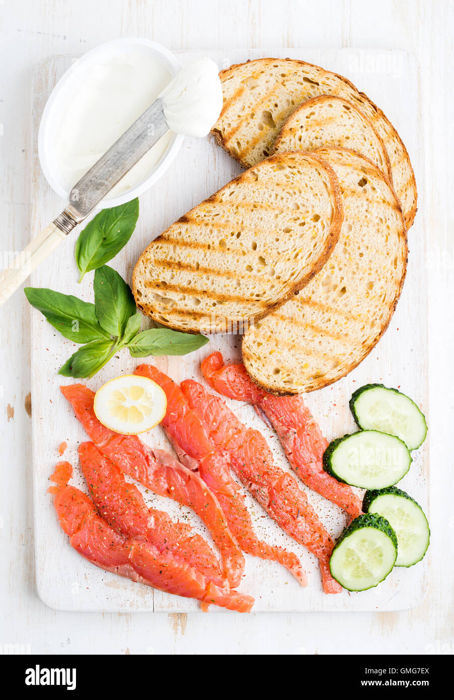 Ingredients for healthy sandwich. Grilled bread slices, smoked salmon