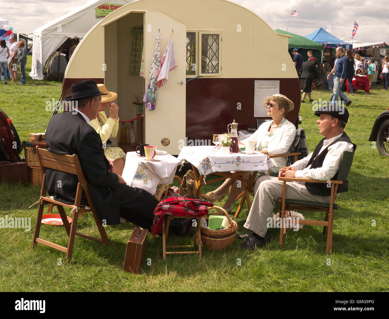 Reenactors taking tea outside of a vintage 1940's caravan at Rauceby war weekend Stock Photo