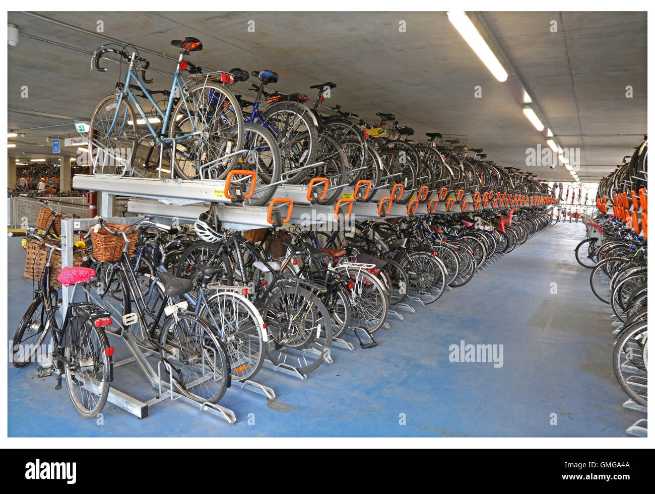 Cycle racks inside a new multi-storey bike park in Cambridge, UK. Adjoins the Ibis Hotel next to Cambridge rail station Stock Photo