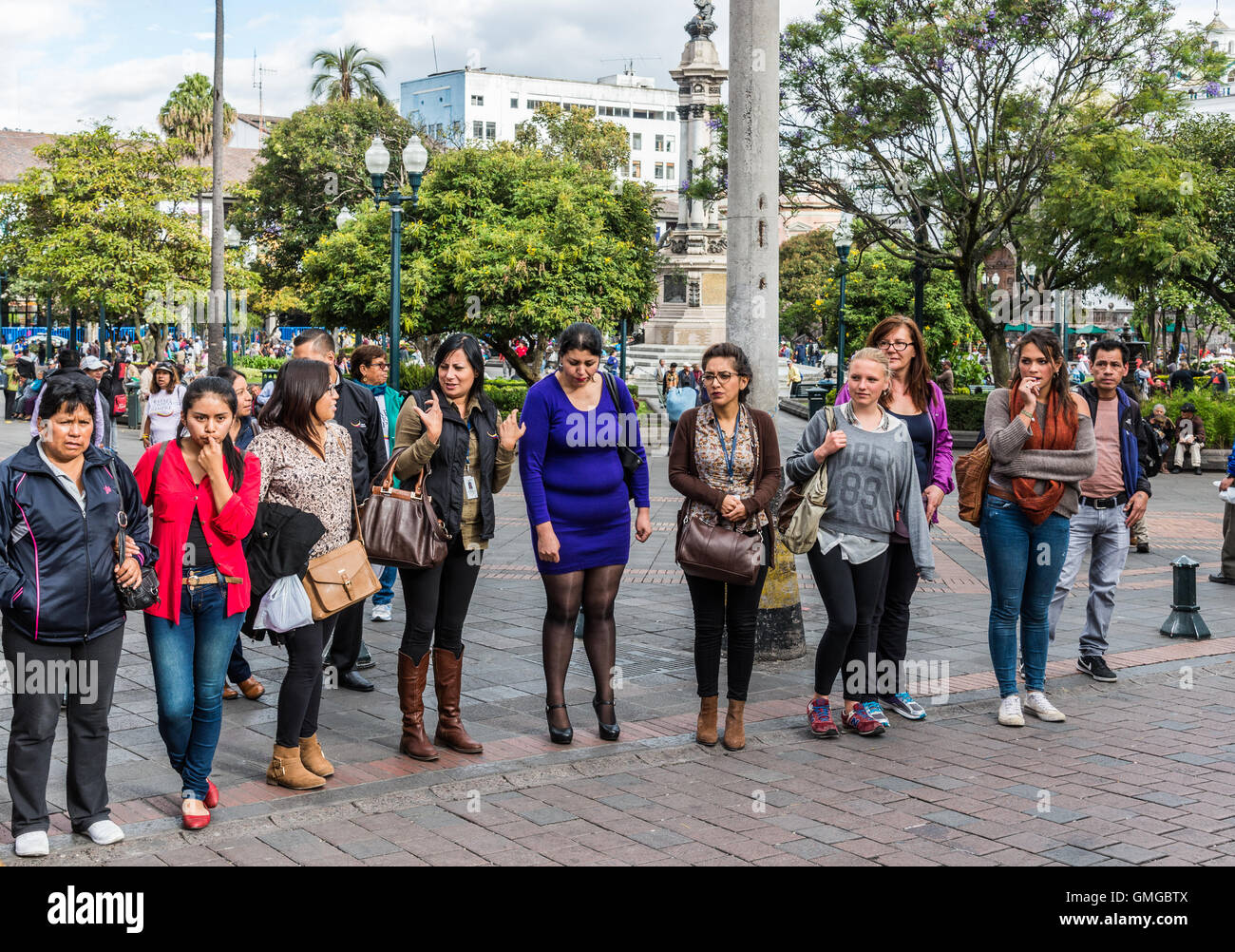 Ladies waiting to cross street in historic old city Quito, Ecuador. Stock Photo