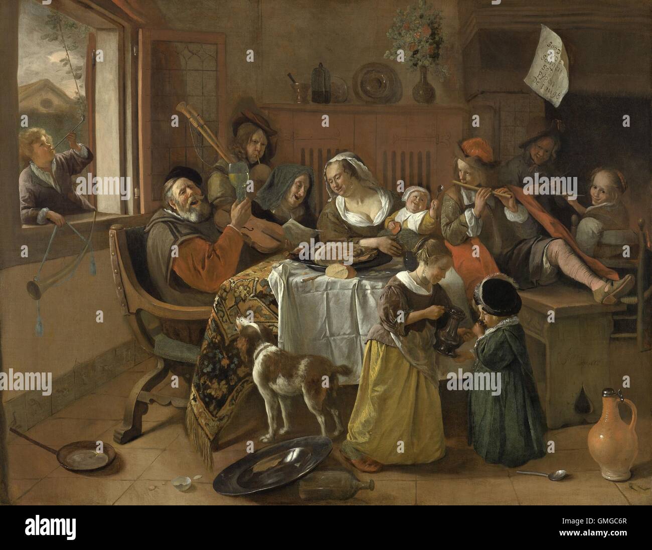 The Merry Family, by Jan Steen, 1668, Dutch painting, oil on canvas. The father sings while raising a glass and the mother and grandmother join in. The children are either blowing into a wind instrument or smoking a long pipe or drinking. A moralizing note hangs on the mantle, ‘As the old sing, so shall the young twitter’ (BSLOC 2016 3 165) Stock Photo