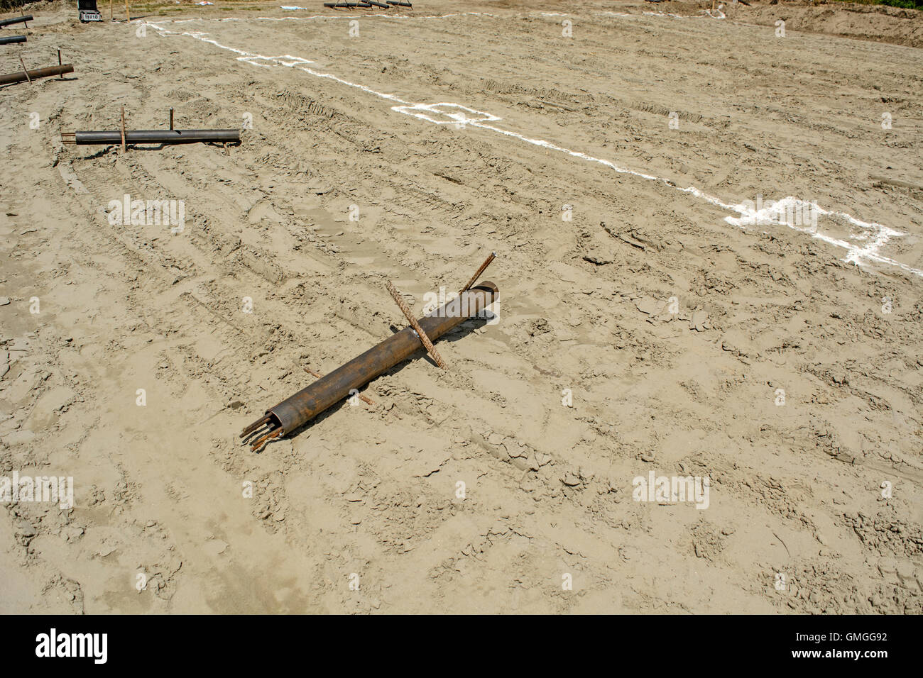 Prepared material for the construction of a sports field on the beach. Stock Photo