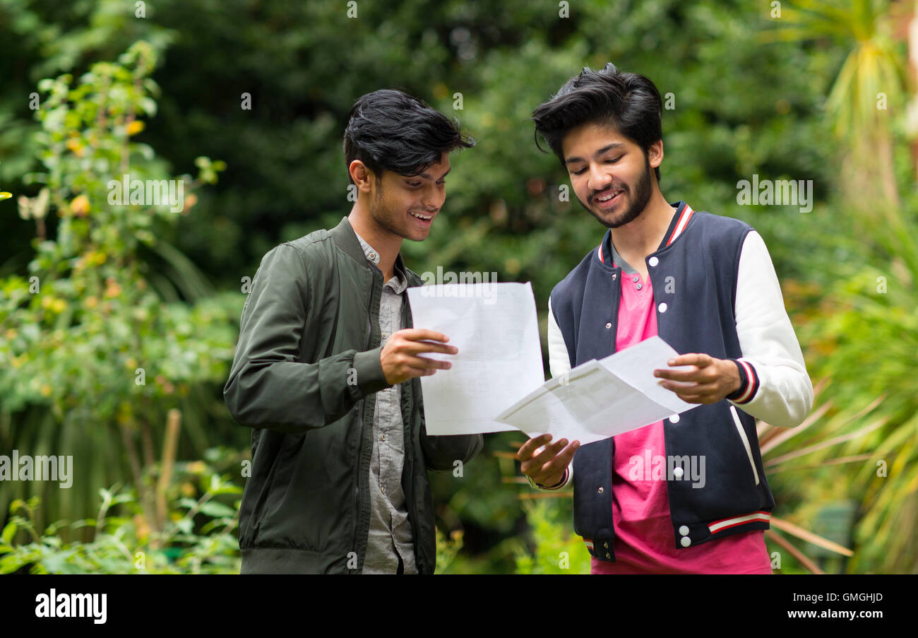 Male students collect their GCSE results at a school. Stock Photo