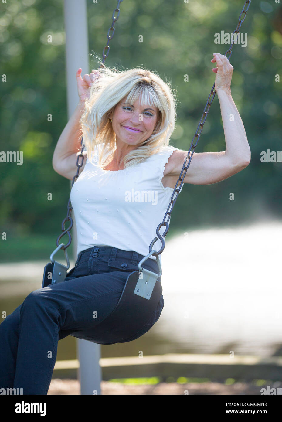 Adult female on a swing hi-res stock photography and images - Alamy