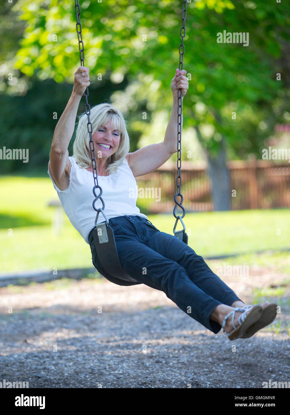 Adult female on a swing hi-res stock photography and images - Alamy