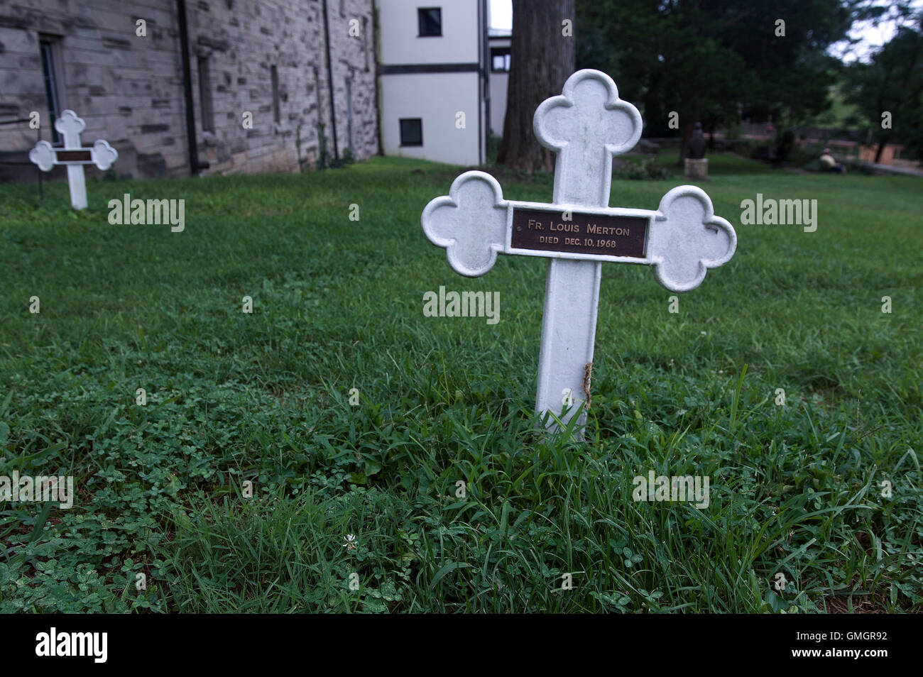 A cross marks the grave of writer, Trappist monk, and peace activist Thomas Merton at the Abbey of Gethsemani in Kentucky. Stock Photo
