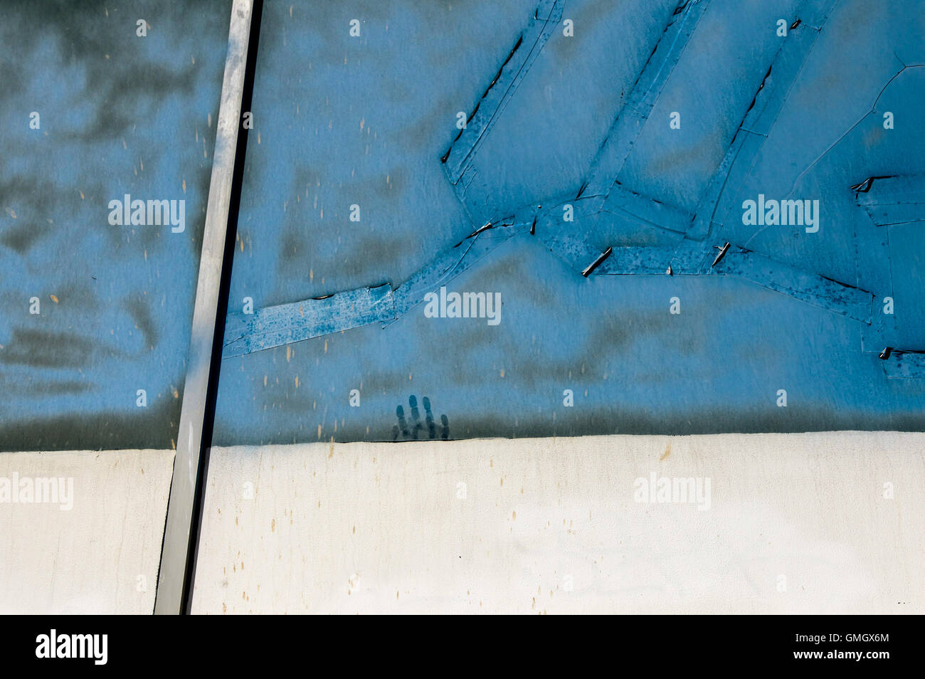 An image of a hand print on an abstract blue background, as if sinking or rising Stock Photo