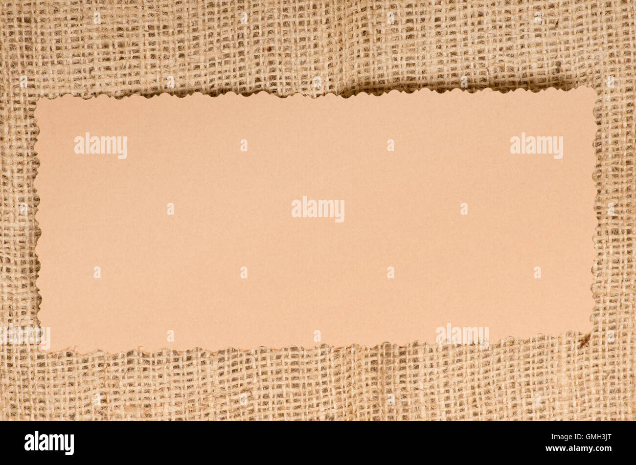 Step by step. Cutting out gift tags from brown paper with a paper punch  Stock Photo - Alamy