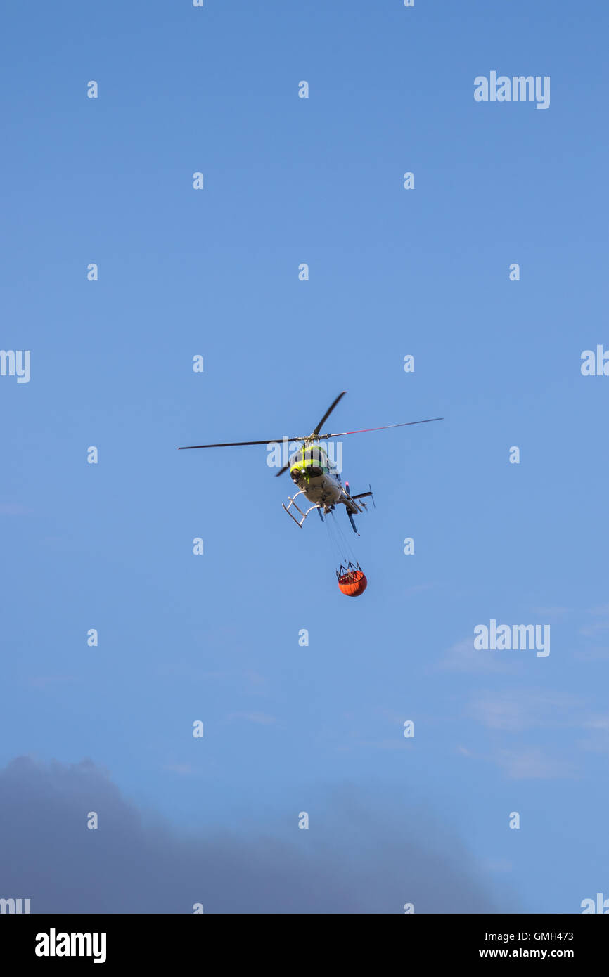 Water dropping firefighting helicopters in flight Stock Photo Alamy