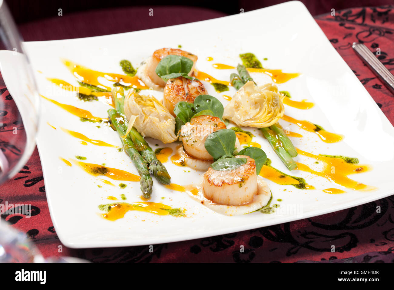 Baked scallops with asparagus Stock Photo Alamy