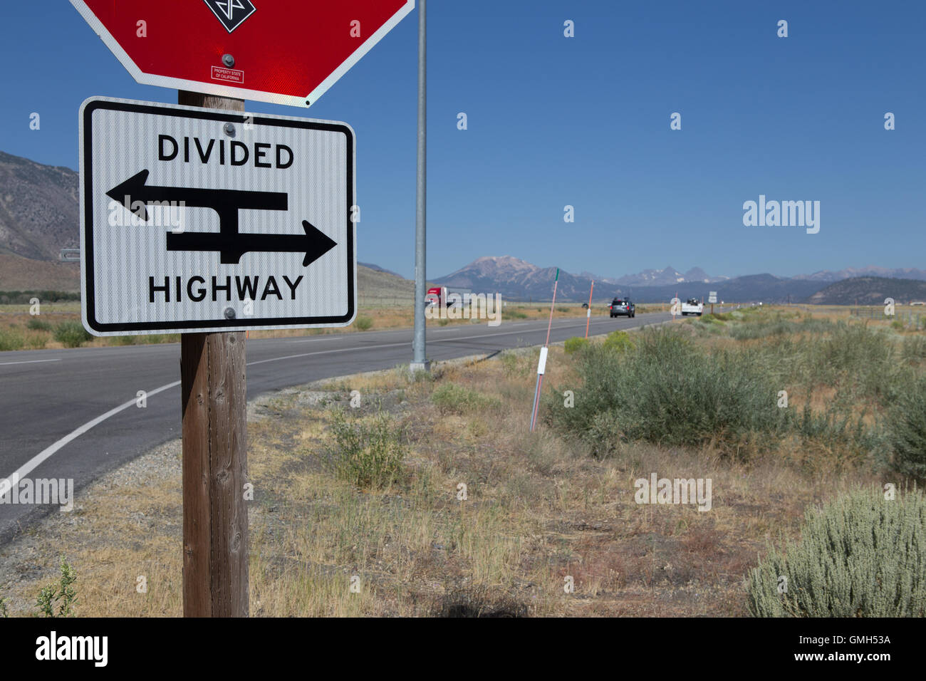 Rural Divided highway sign on highway 395 heading north in California USA Stock Photo