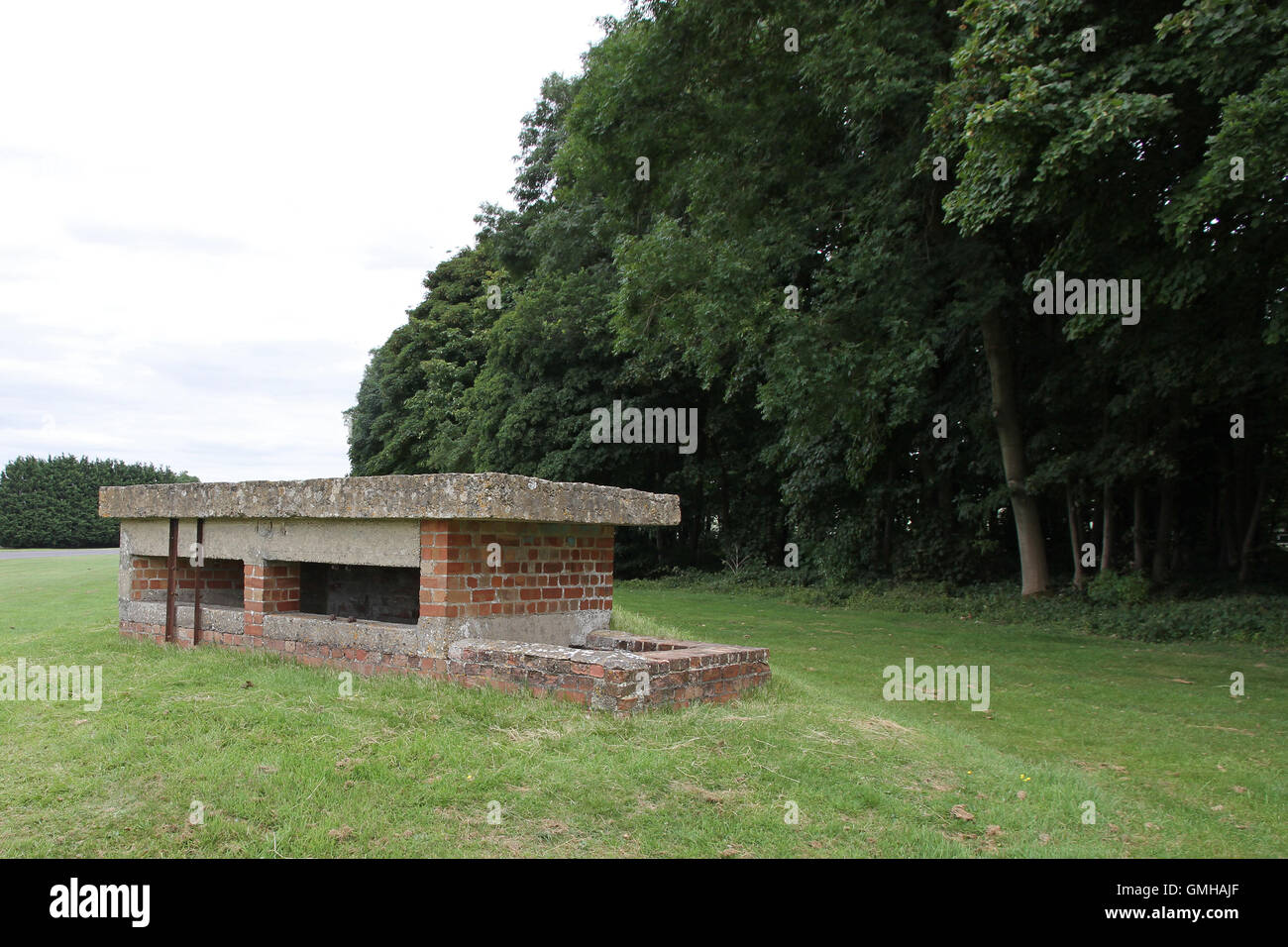 An old disused sunken anti invasion / tank second world war airfield defence pillbox located in Gloucestershire on a former RAF airfield at Kemble Stock Photo